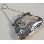 A George V silver evening purse, with bright cut decoration and orb clasps, hinging to reveal a