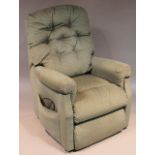 A modern electric reclining chair, in textured green and white floral pattern material, 140cm high.