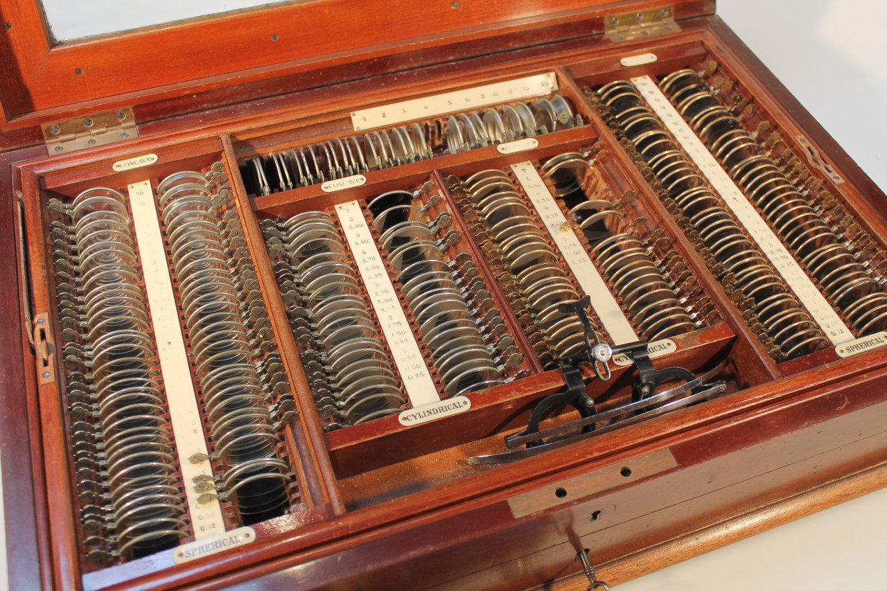 An early 20thC mahogany opticians tester lens set, the rectangular box with a bevelled glass door, - Image 2 of 3