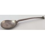 A George V silver Arts and Crafts design spoon, by James Deakin & Sons with a shaped bowl, Sheffield