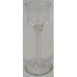 An early 18thC English cordial glass, with plain bowl above a double air twist stem on a circular