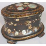 A Victorian papier mache and mother of pearl tea caddy, of oval outline the hinged lid decorated