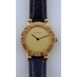 A Tiffany & Co 18ct gold ladies wristwatch, with gold coloured dial, Roman numerals, with black