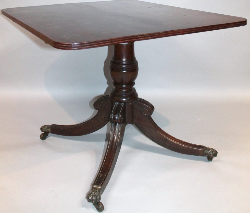A mid-19thC flame mahogany occasional table, the rounded top with a fluted outline raised on a