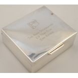 An Elizabeth II silver cigarette case, by G & Co. Ltd. the rectangular lid with thumb mould handle