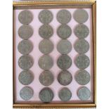 Various pre-decimal coins, comprising crowns and half crowns, in a fitted framework, 23cm x 19.5cm.