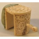 A late 19thC Anglo Indian ivory pin cushion, with an articulated clamp top, heavily decorated with