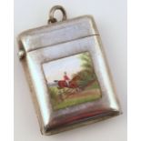 An early 20thC silver vesta case, the oblong body enamelled with a figure on horse back jumping a