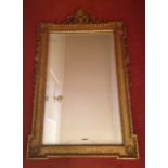 A pair of 19thC giltwood and gesso wall mirrors, in the manner of William Kent, with shell and