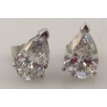 A pair of diamond earrings, in the pear cut, approximately 4.5cts, with screw on backs, yellow metal