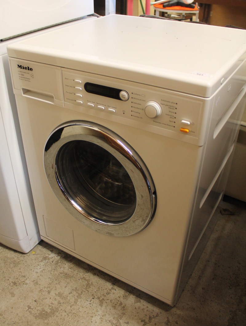 A Miele Honeycomb W5780 washing machine, in white, 85cm high, 60cm wide, 58cm deep.