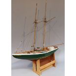 A 20thC wooden model yacht, of the Helen B Thomas, with authentic rigging mast and deck set with