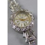A diamond ladies cocktail watch, in the Art Deco style, in white metal setting, unmarked, possibly