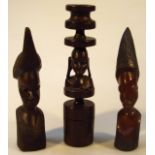 Various African tribal hardwood items, to include a shaped candlestick centred with a figure on a