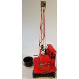 A 1950's LA Ross tin plated crane, stamped Jones K L 44, in red with an articulated base and