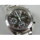 An Omega Seamaster gentleman's wristwatch, with black dial, picked out in red, stainless steel,