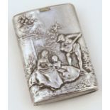 A 19thC Dutch snuff box, repoussé decorated with a figure playing instrument before lady and tree,