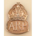 A George VI silver Air Raid Patrol (ARP) silver badge, by J C, with a shaped outline and clip