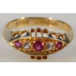 An 18ct gold dress ring, set with pink and white stones on a pierced ellipse setting, size M, 2g all