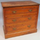 An Edwardian satin walnut chest, of three long drawers on a block base with a overhanging top,