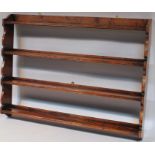 A modern oak Delft rack, by Titchmarsh & Goodwin set with four plate racks with carved supports,