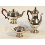 An Elizabeth II silver three piece tea and coffee service, by William Comyns, comprising coffee