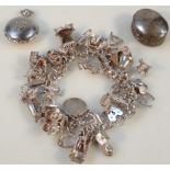 A 20thC charm bracelet, to include a quantity of various charms: car, 1cm high, miniature ring,