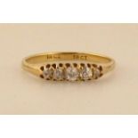 A ladies graduated five stone old brilliant cut diamond ring, the yellow metal shank marked 18ct,
