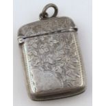 A late Victorian silver vesta case, by John Gammage, the oblong body part decorated with floral