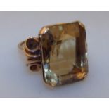 A ladies heavy claw set citrine ring, on a part pierced yellow metal shank, 12.5g all in, size O.