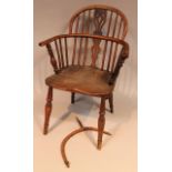 A 19thC yew and elm low back Windsor chair, with a pierced back splat, 'C' scroll arm supports and