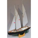 A 20thC wooden model yacht, the Shiri, with rigging mast and deck set with cabin, etc, fitted on a
