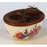 A 19thC Continental porcelain inkwell, of oval outline with articulated metal mounts with space