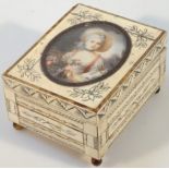 An early 20thC ivory finish jewellery casket, the hinged lid set with an oval profile of a lady,