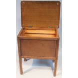 A mid-20thC stained beech sewing box, with rounded ends on square fluted stylized fluted supports,