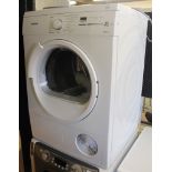 A Siemens 300 tumble dryer, with traces of original plastic covering, 86cm high, 61cm wide, 58.5cm