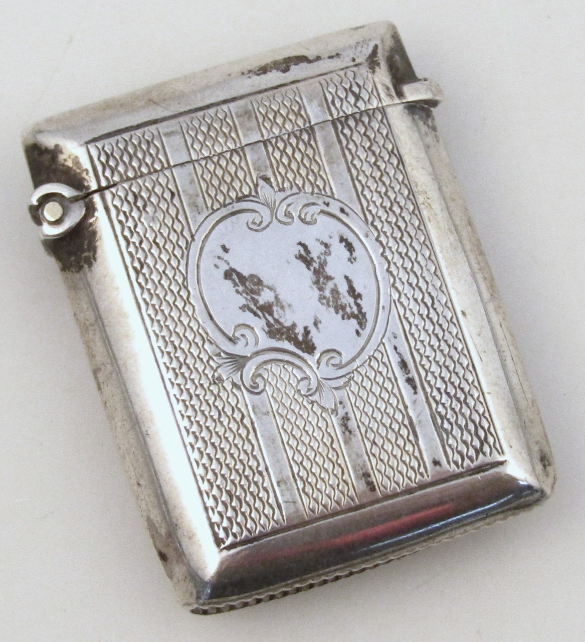 A late Victorian silver vesta case, probably Joseph Whitten with engine turn body and vacant