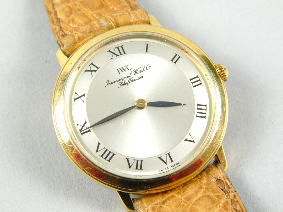An International Watch Company gentleman's wristwatch, with silvered coloured dial and black