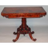 A Victorian figured walnut card table, the rectangular top with rounded ends opening to reveal a