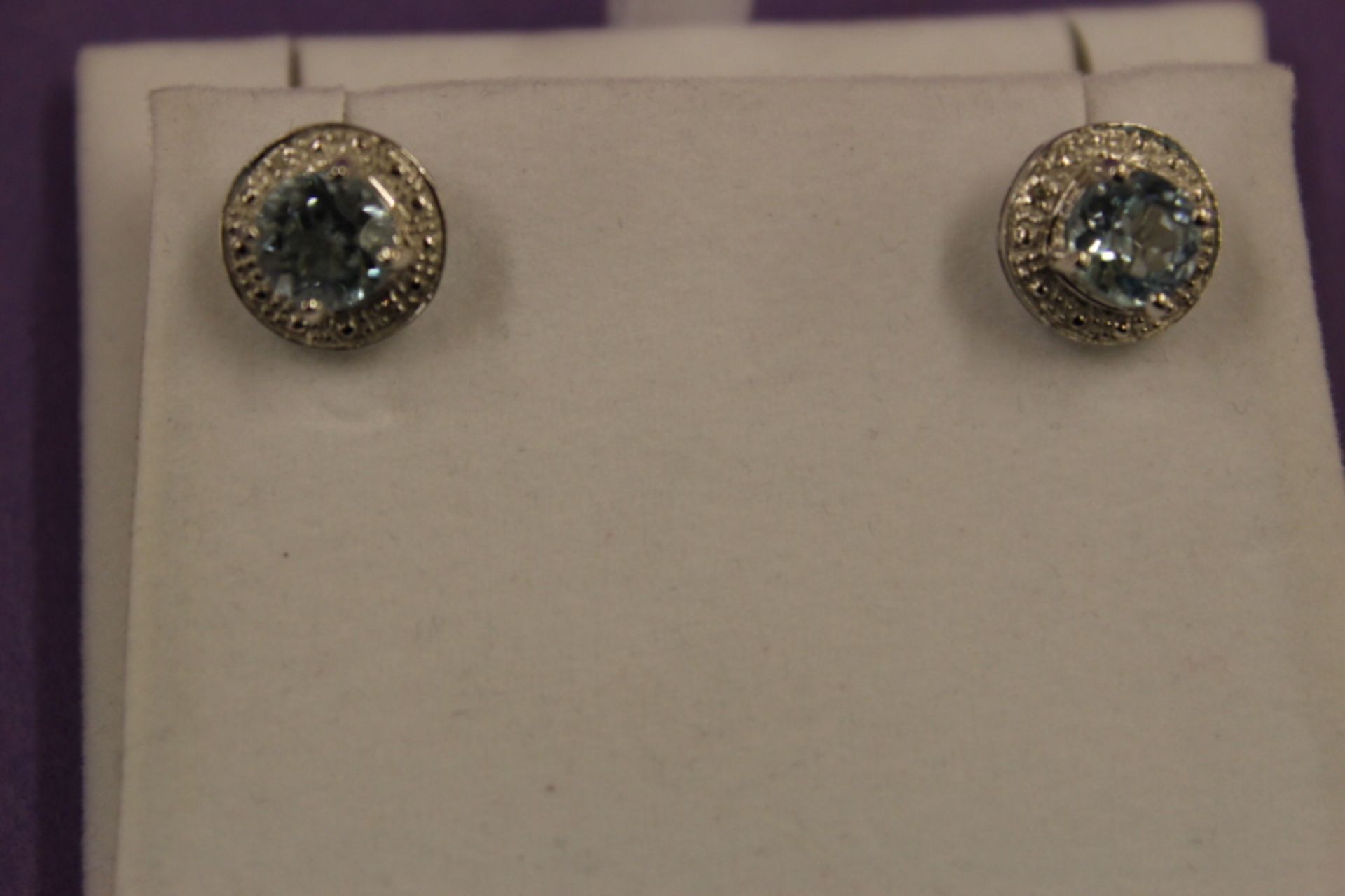 Pair WM (925) Blue Topaz & Diamond Round Earrings