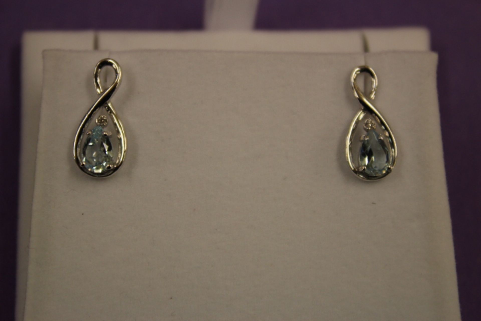 Pair WM (925) Blue Topaz & Diamond Figure Eight Earrings