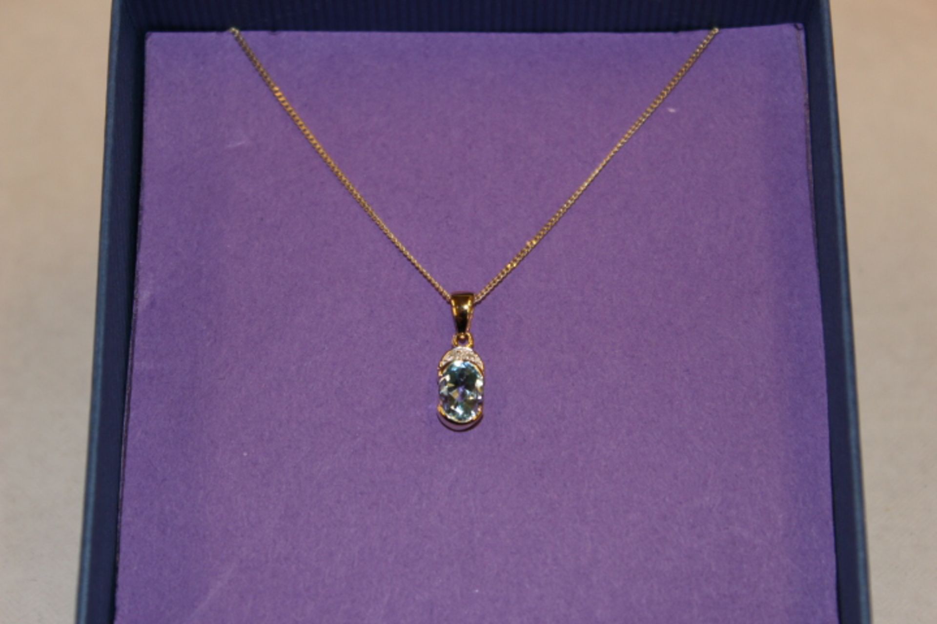 V Gold Blue Topaz & Diamond Pendant On Gold Chain