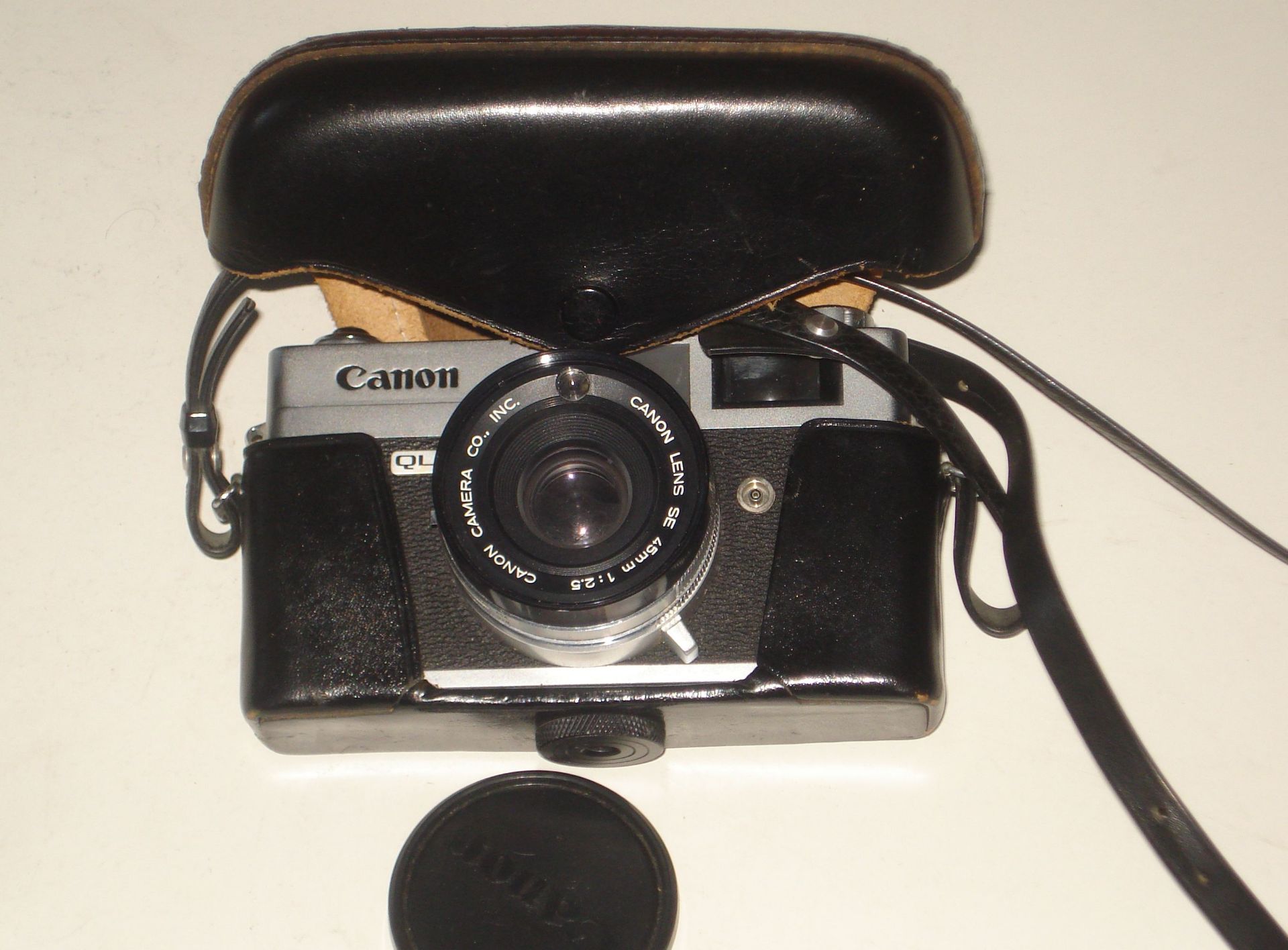 Old Canon QL camera and case