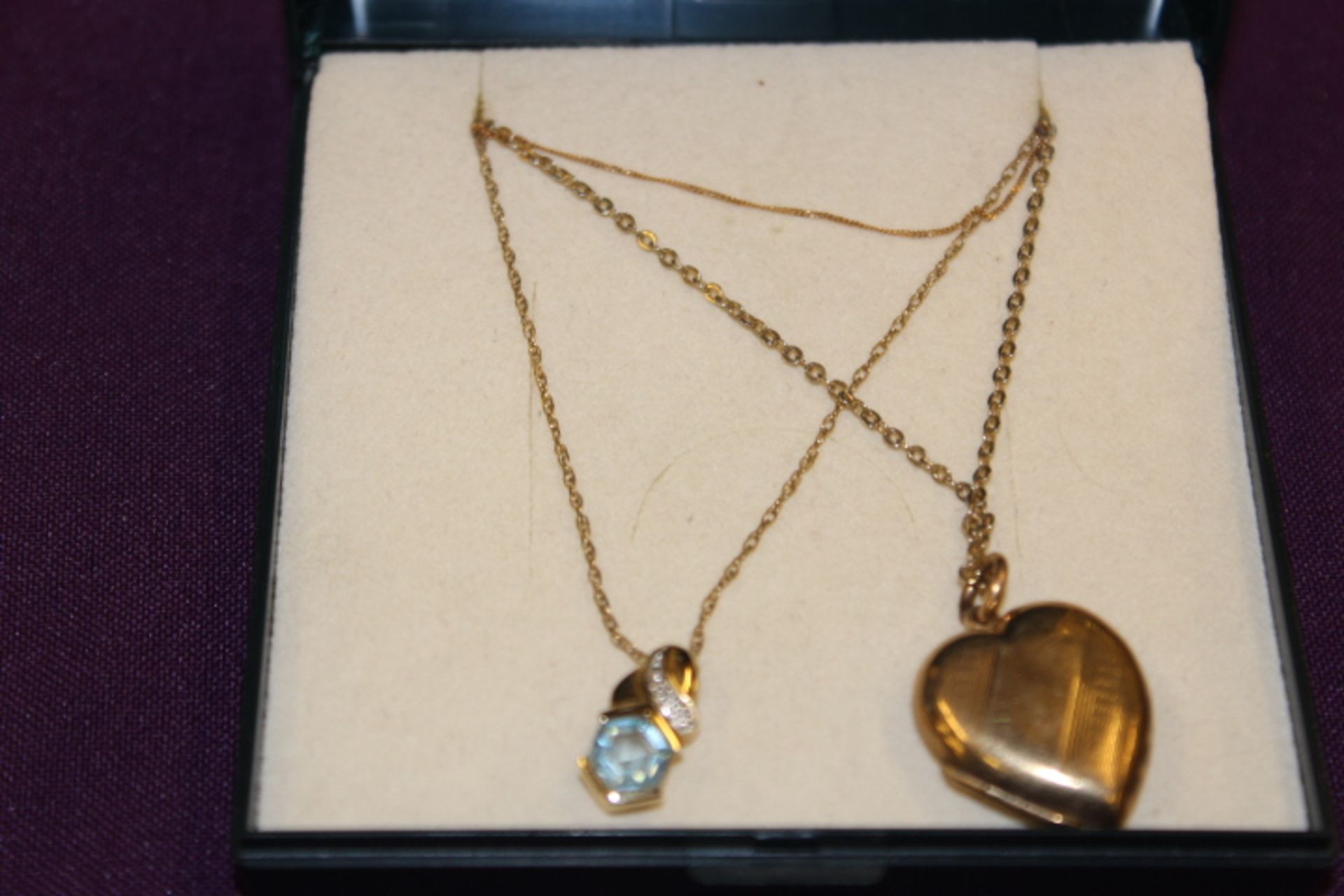 V Yellow Metal Heart Locket And Chain With Yellow Metal Blue And White Stone Pendant