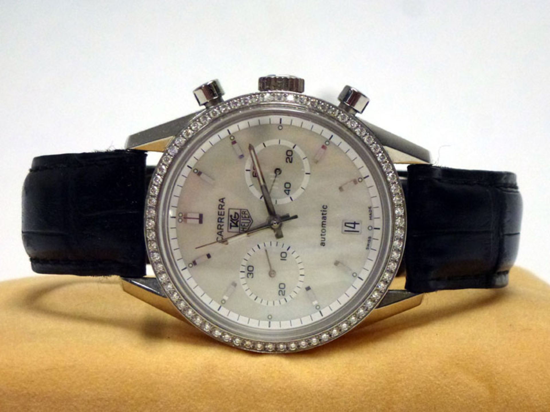 A Tag Heuer 'Carrera' wristwatch, featuring a rare factory white diamond bezel and mother of pearl