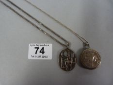 Silver locket on chain, and an unusual silver pend