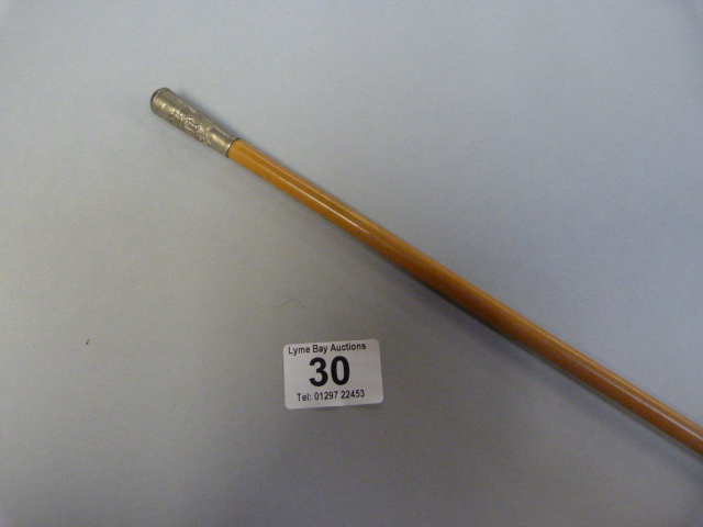 A Malacca swagger stick with the insignia of the D