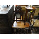 Pair of mahogany hall chairs, each set with a tile