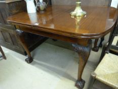 A Mahogany drawer leaf table on claw and ball feet