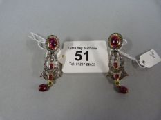 Pair of ruby and natural rose cut earrings- total